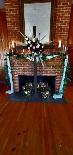 cross in front of fireplace
