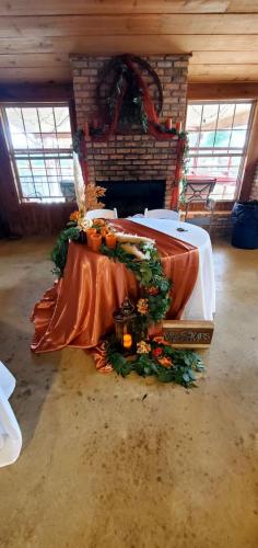 burnt orange bride and groom table decor