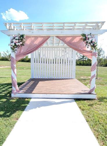 pink drapery and flowers on wedding altar