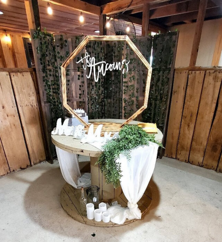 wedding cake table with personalized arch and decor