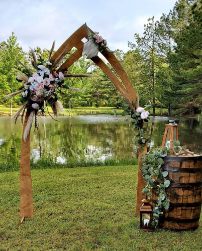 wedding arch and whiskey barrel